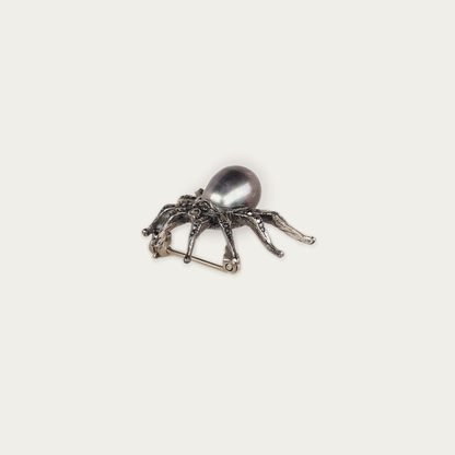 Arachne Brooch in oxidized sterling silver with marcasite stones and a 9mm dark pearl, 1.8cm by 2.5cm, traditional pin back closure.