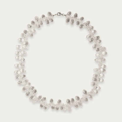 Glint Necklace with faceted 13mm clear crystals, 16-inch length, sterling silver lobster clasp, designed for dynamic light reflection.