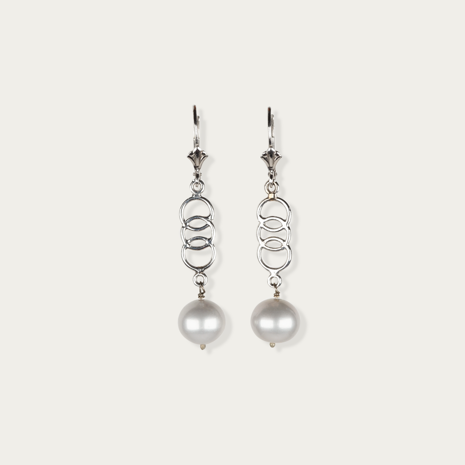 Sway Earrings in 14k white gold with freshwater pearls suspended from open links, 1.75-inch drop, fishhook ear wires.