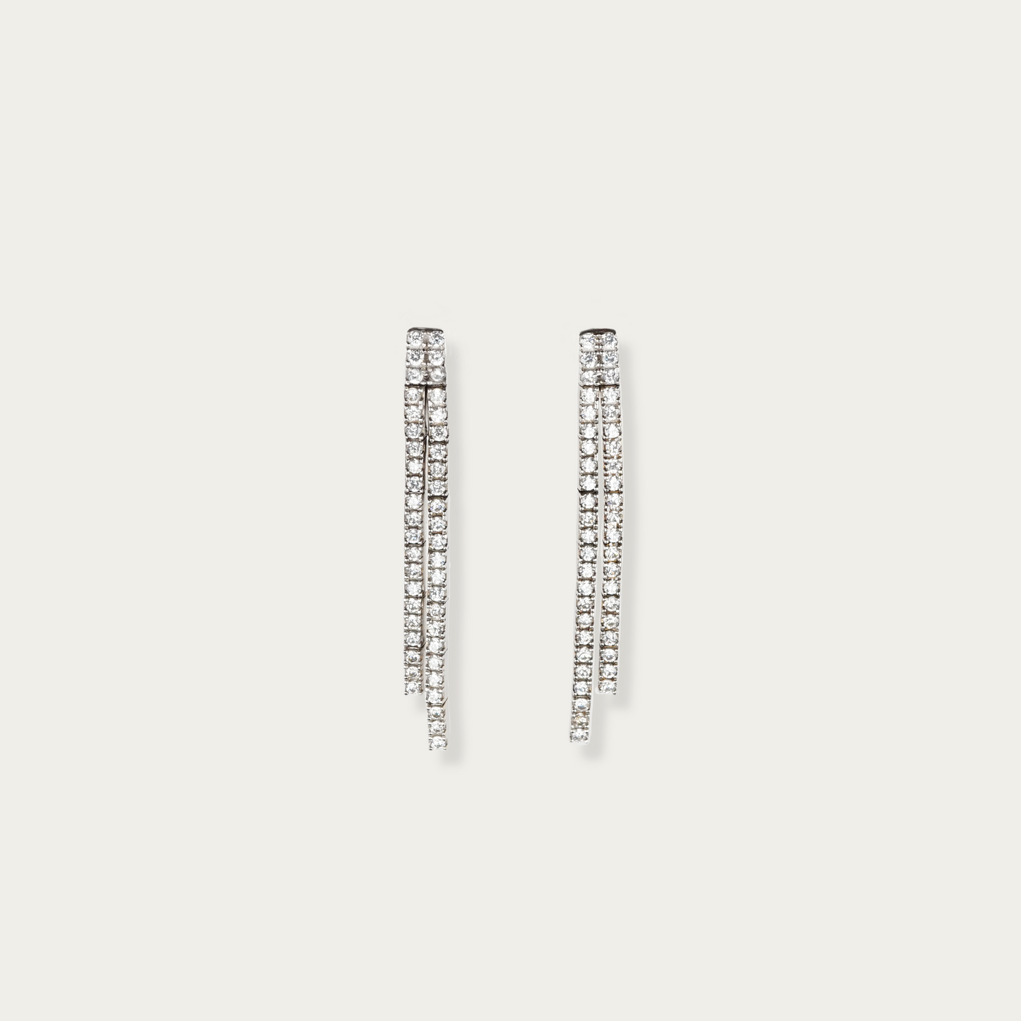 Lane Change Earrings in 18k white gold with two fine parallel lines of cubic zirconia, 1.45-inch length, linked dash segments for gentle curve and movement.