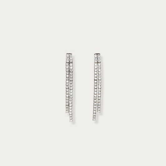 Lane Change Earrings in 18k white gold with two fine parallel lines of cubic zirconia, 1.45-inch length, linked dash segments for gentle curve and movement.