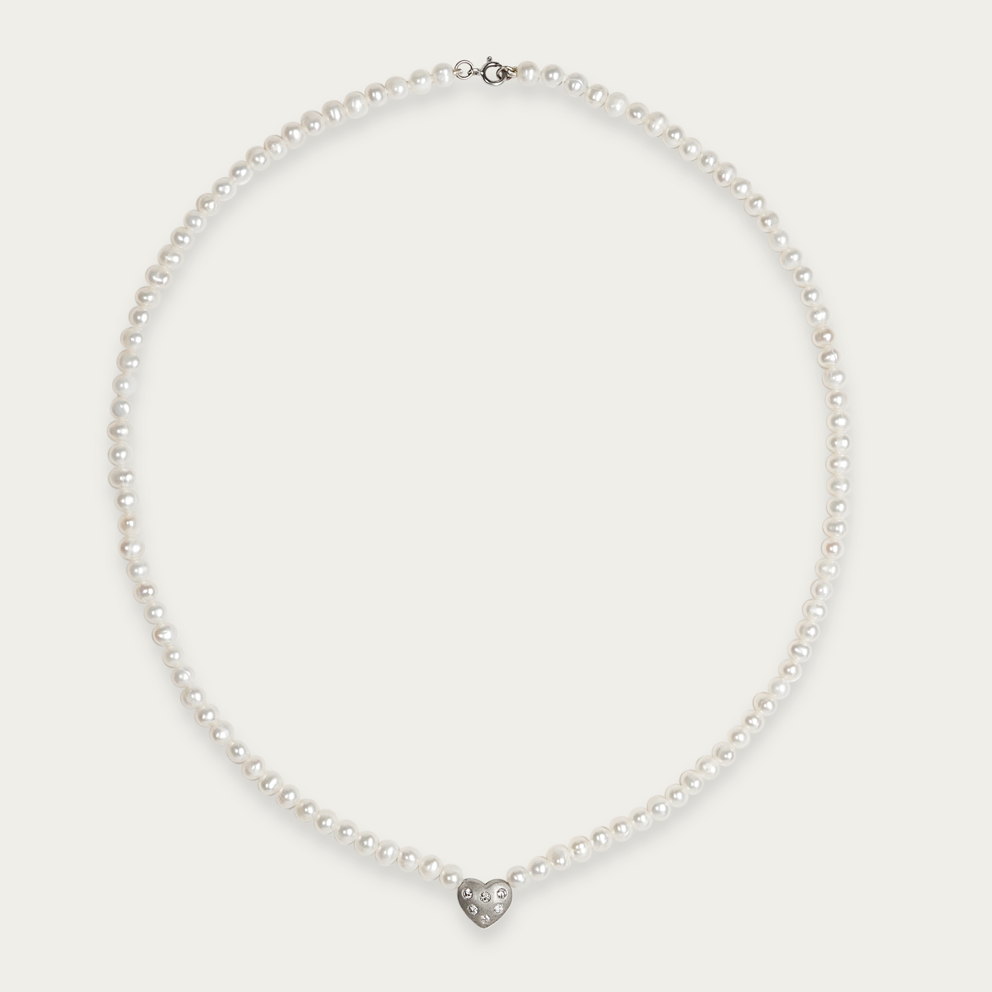 Amora Necklace with 5mm freshwater pearls and matte-finished heart charm set with six diamonds, 17-inch length, 14k white gold chain with spring ring clasp.