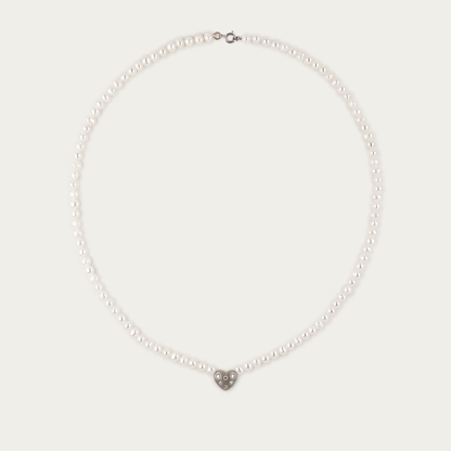 Amora Necklace with 5mm freshwater pearls and matte-finished heart charm set with six diamonds, 17-inch length, 14k white gold chain with spring ring clasp.