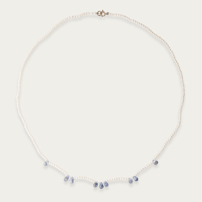 Azure Necklace with 1.5mm freshwater pearls and nine 5mm faceted blue sapphires, 16-inch length, 14k white gold spring ring clasp.