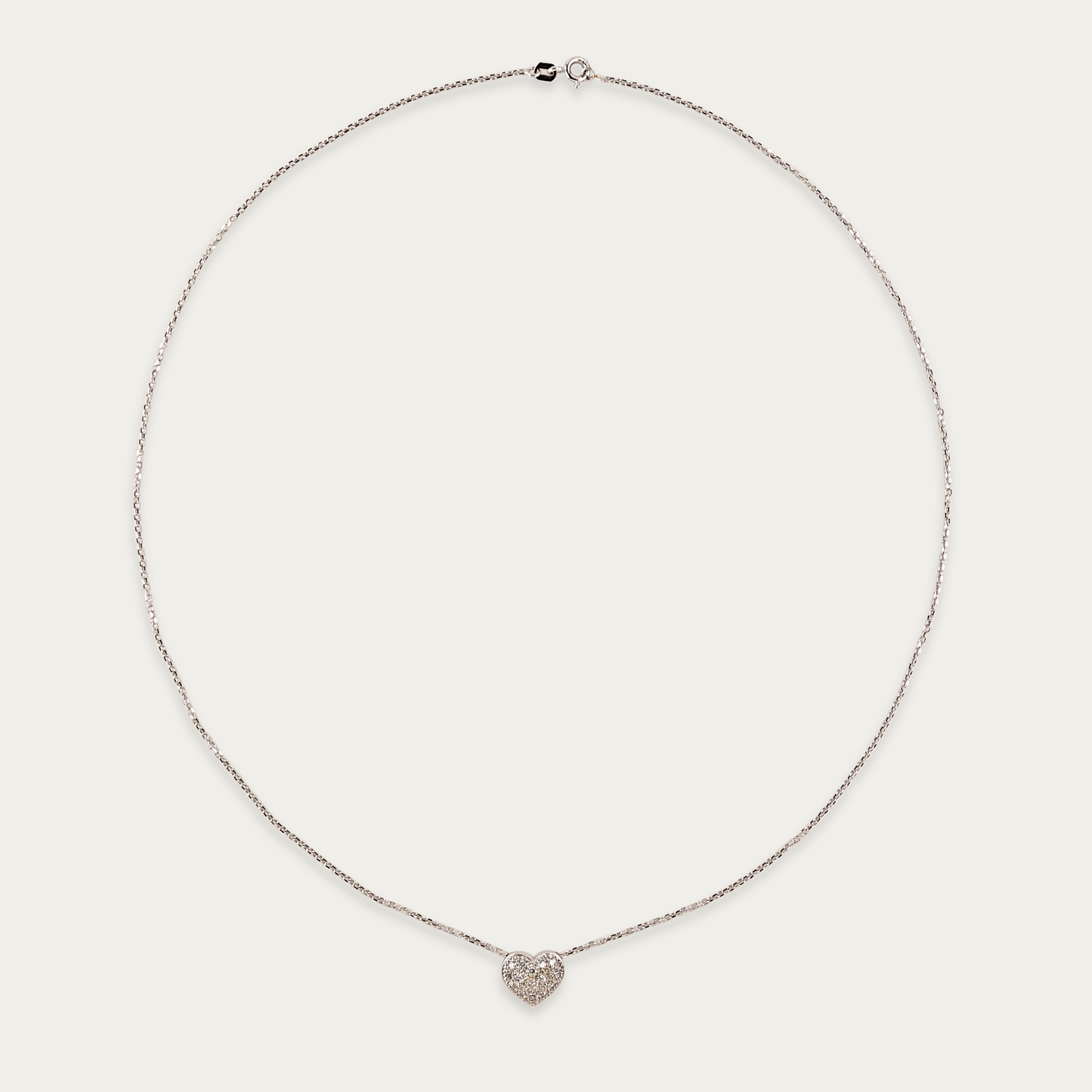 Soft Launch necklace in 18k white gold with diamond-set rounded heart pendant, 12mm wide, sliding on 19-inch chain with spring ring clasp.