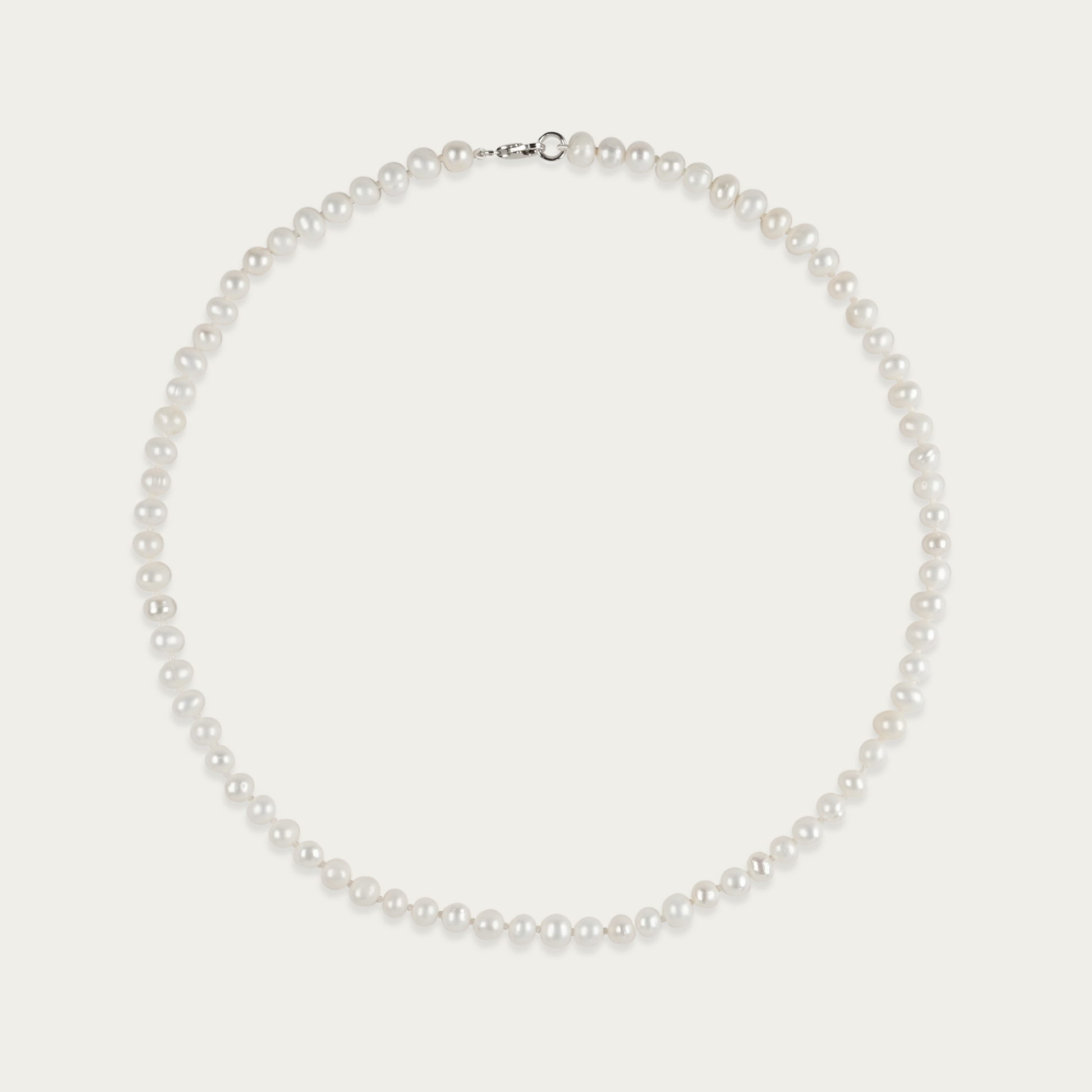 Off Label Necklace with smooth, pill-shaped freshwater pearls, 15-inch choker length, sterling silver clasp, slightly irregular by design.