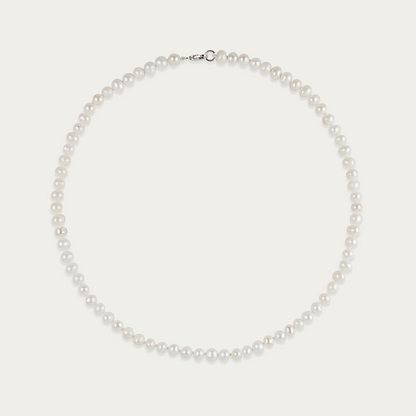 Off Label Necklace with smooth, pill-shaped freshwater pearls, 15-inch choker length, sterling silver clasp, slightly irregular by design.