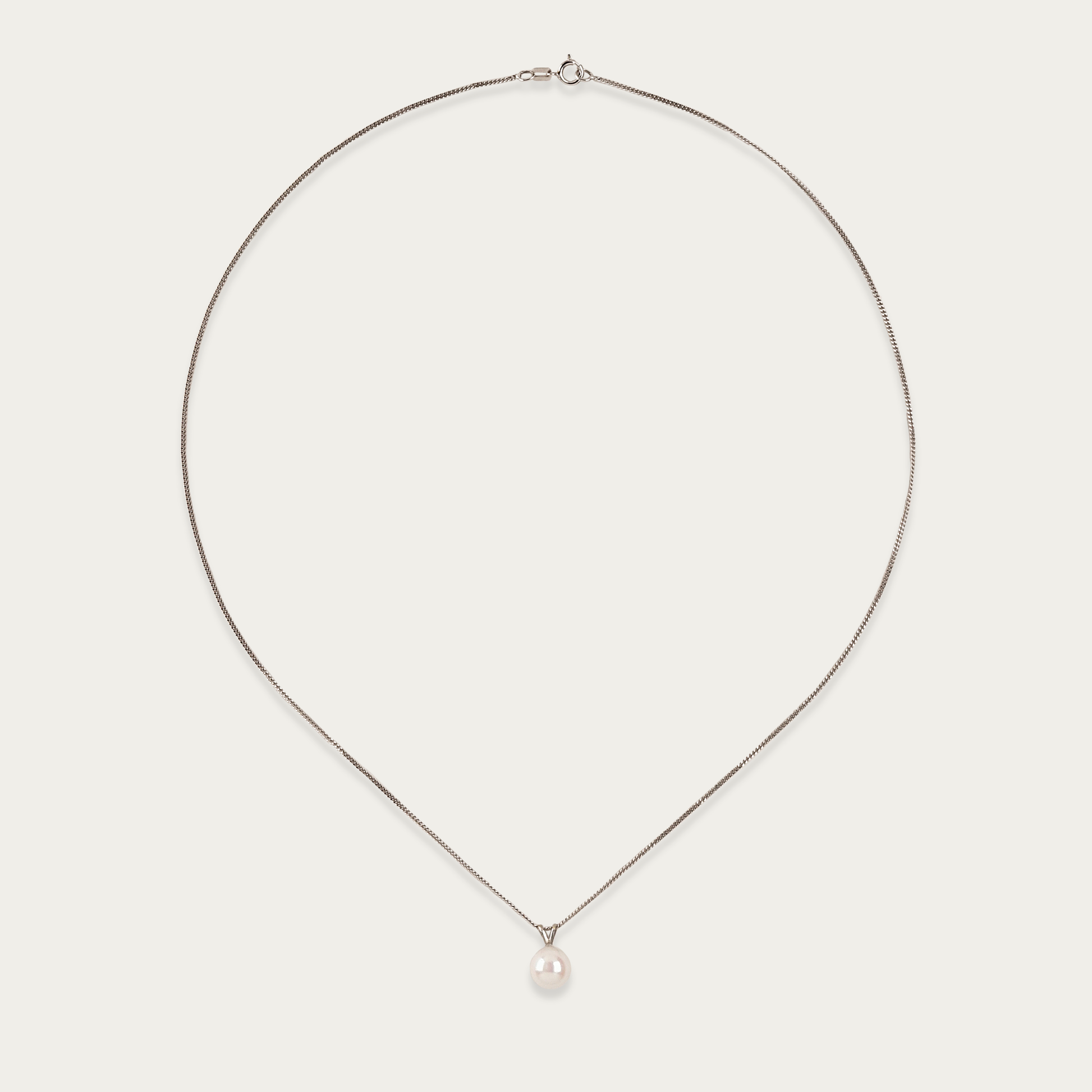 Pivot necklace with single 7mm cultured pearl suspended on 14k white gold chain, 18-inch length, spring ring clasp.