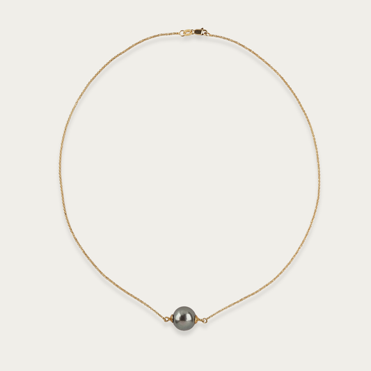 Necklace with single 11mm South Sea cultured pearl centered on 18k yellow gold chain, 16-inch length, lobster clasp closure.